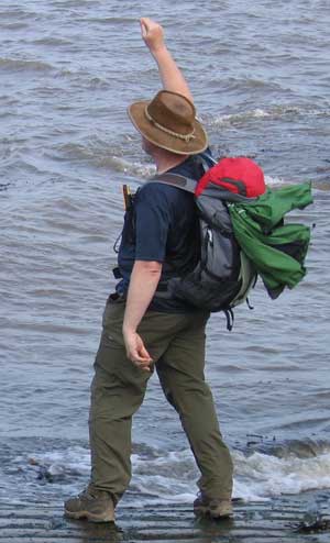 Steve carried a small part of St Bees all the way across England; arriving in Robin Hoods Bay he unceremoniously chucks the pebble into the freezing cold North Sea. Poor thing. Steve enthusiastically lobs his pebble into the cold waters of the North Sea