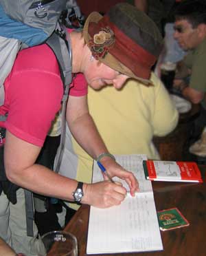 Thousands of people complete the coast to coast walk each year; and the Bay Hotel has 'The Register'. Here we see Steff adding herself and Steve alongside those other determined folk. Steff signs the Coast to Coast register